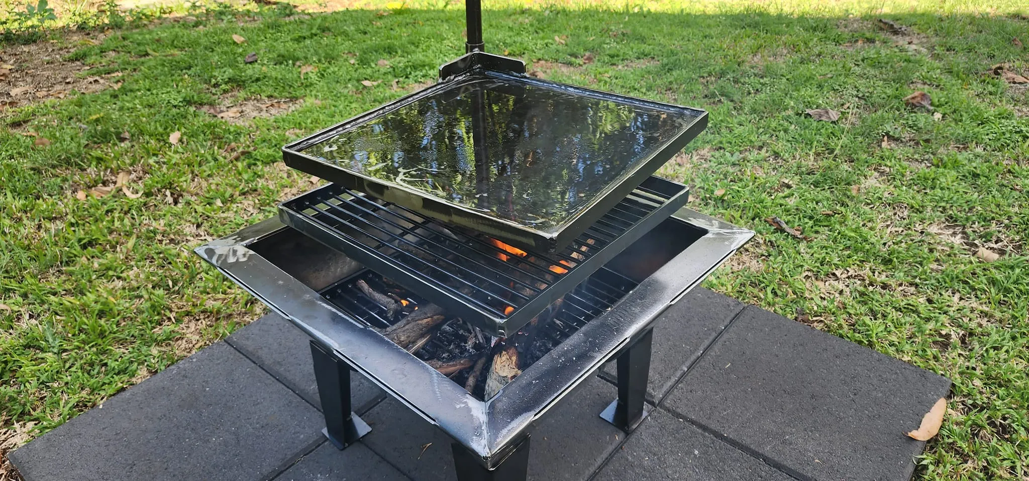 Backyard Fire Pit with Square Grill and Hot Plate.