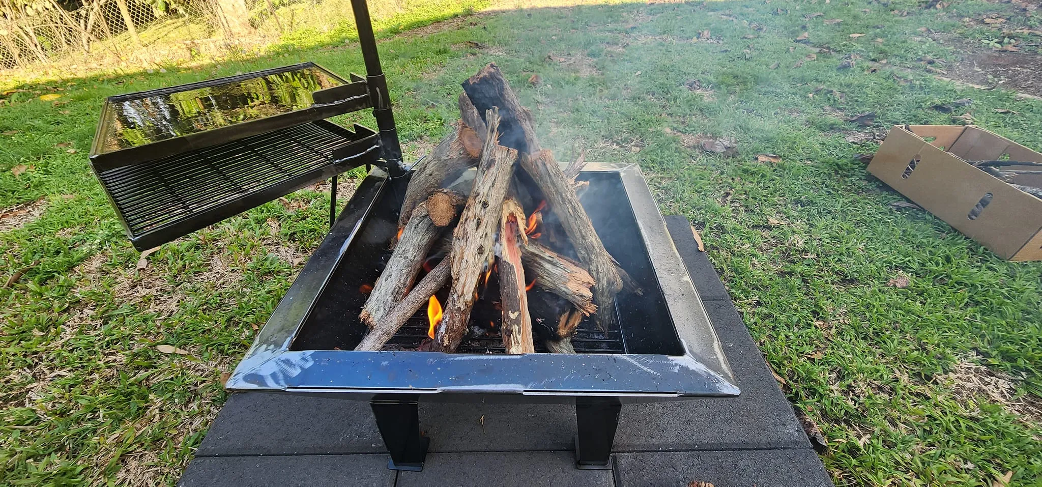 Backyard Fire Pit with Square Grill and Hot Plate.