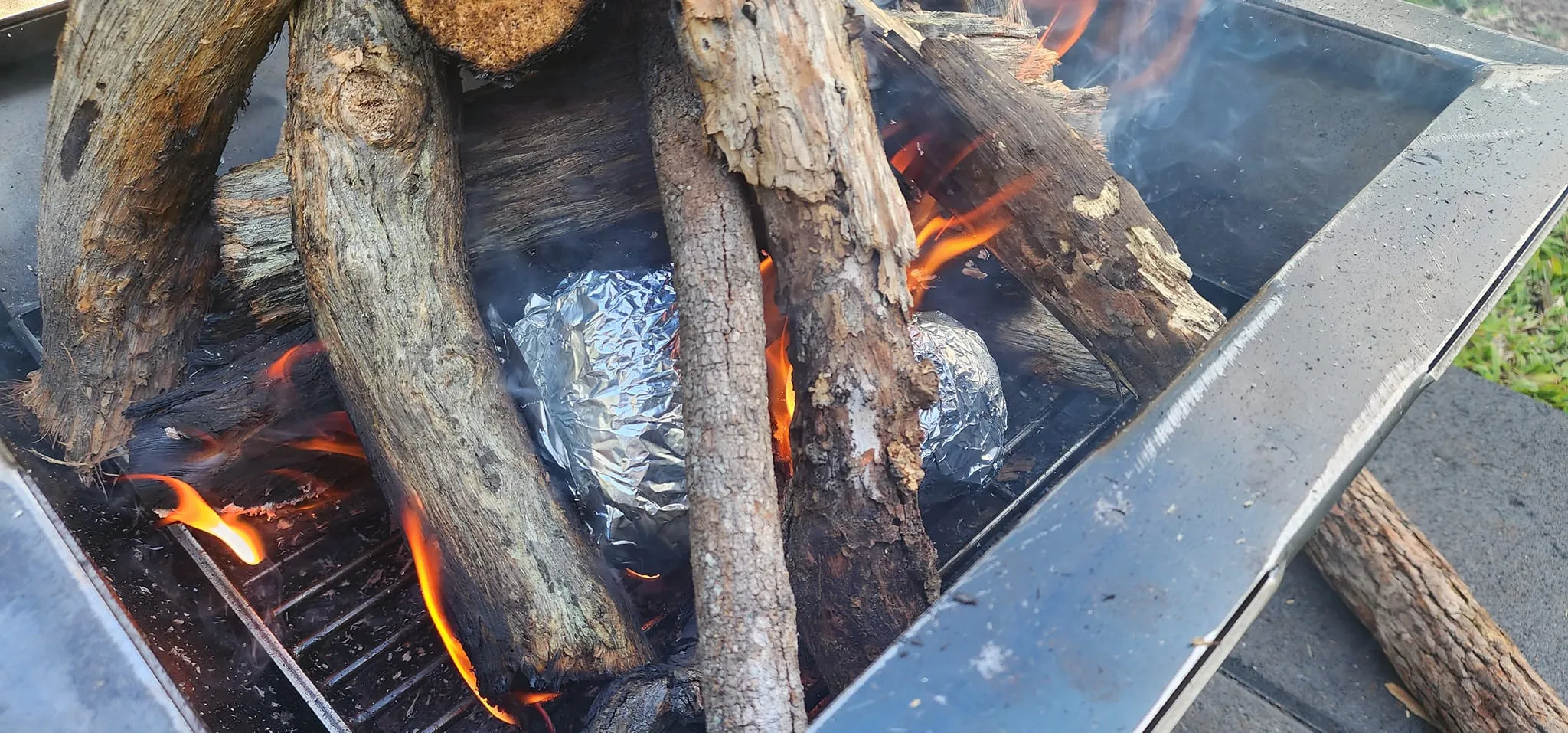 Backyard Fire Pit with Square Grill and Hot Plate.