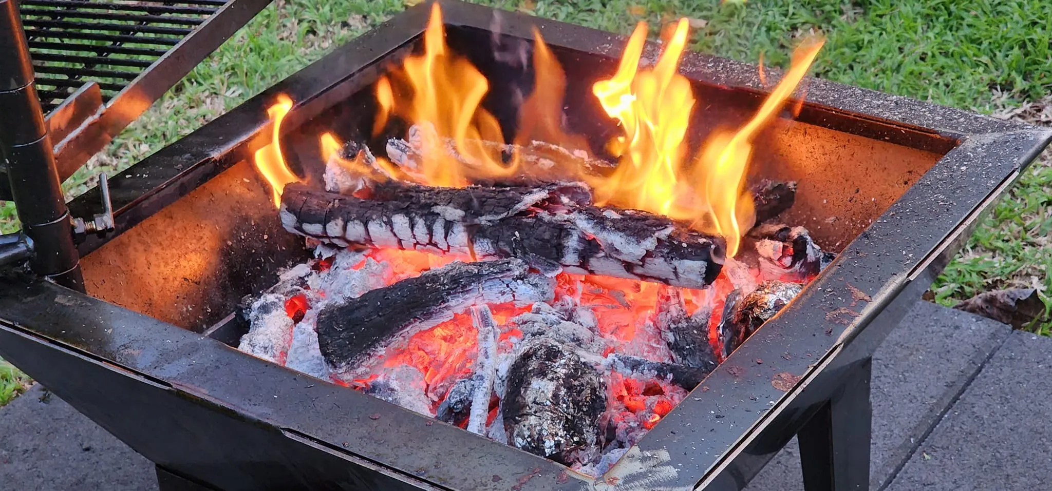 Backyard Fire Pit with Square Grill and Hot Plate.